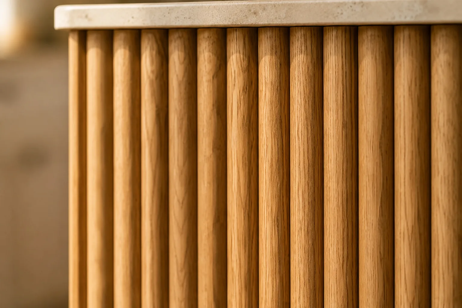 A close-up of vertical fluted oak panelling on an island face