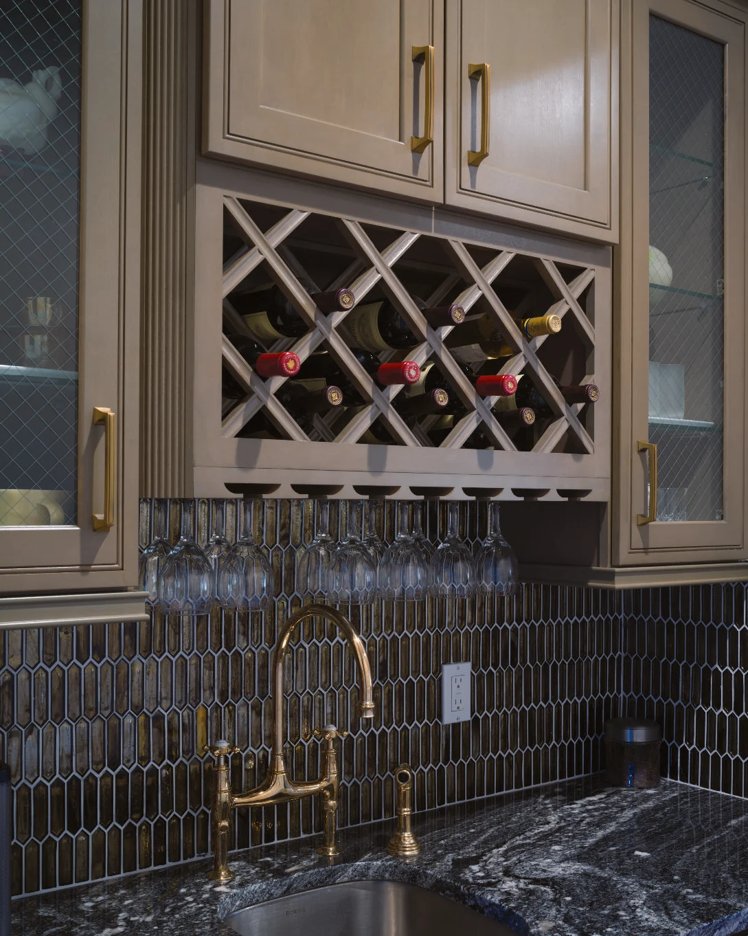 A kitchen featuring a dark, hand-finished J&K cabinetry style