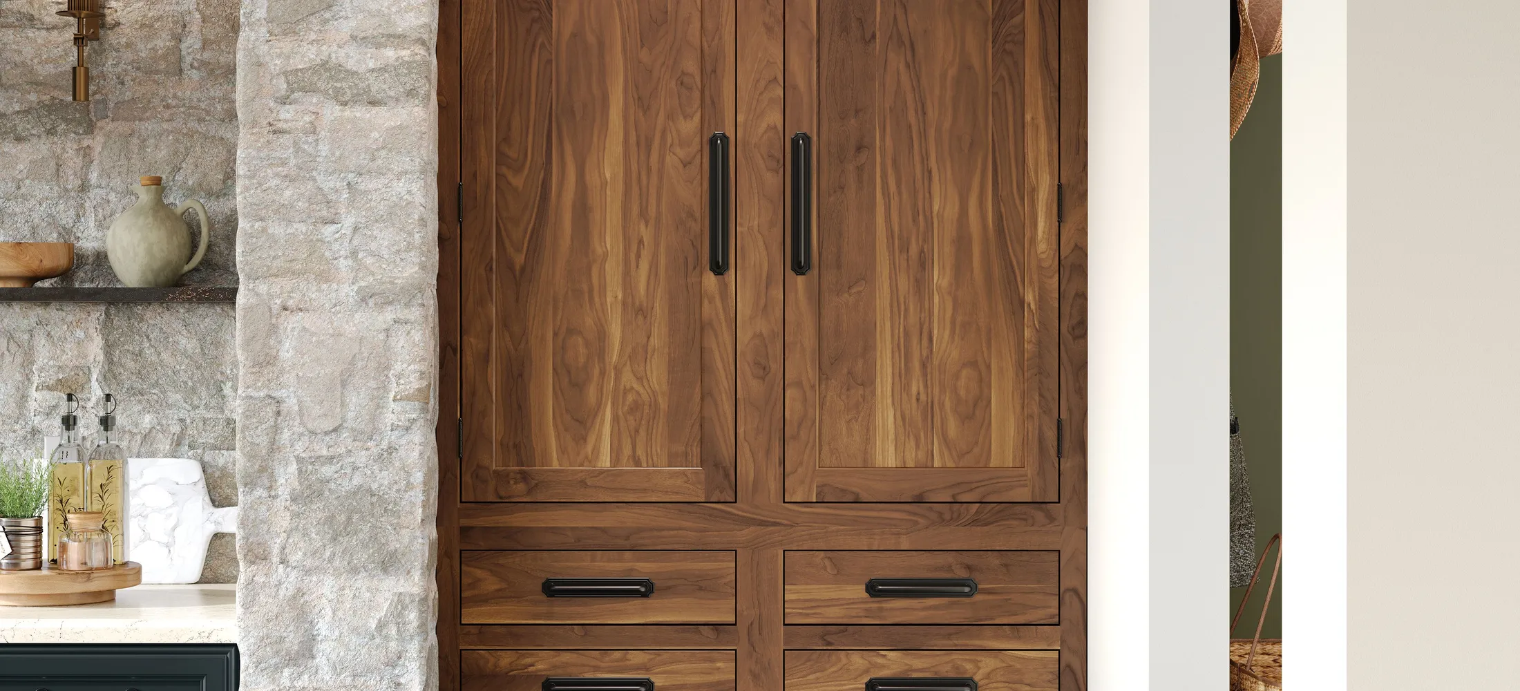 Kemper walnut cabinetry against a natural stone wall