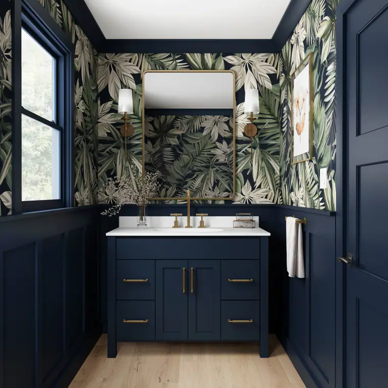 Bold powder room with a navy vanity and tropical wallpaper