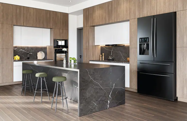 Wood Fabuwood kitchen with a black marble waterfall island