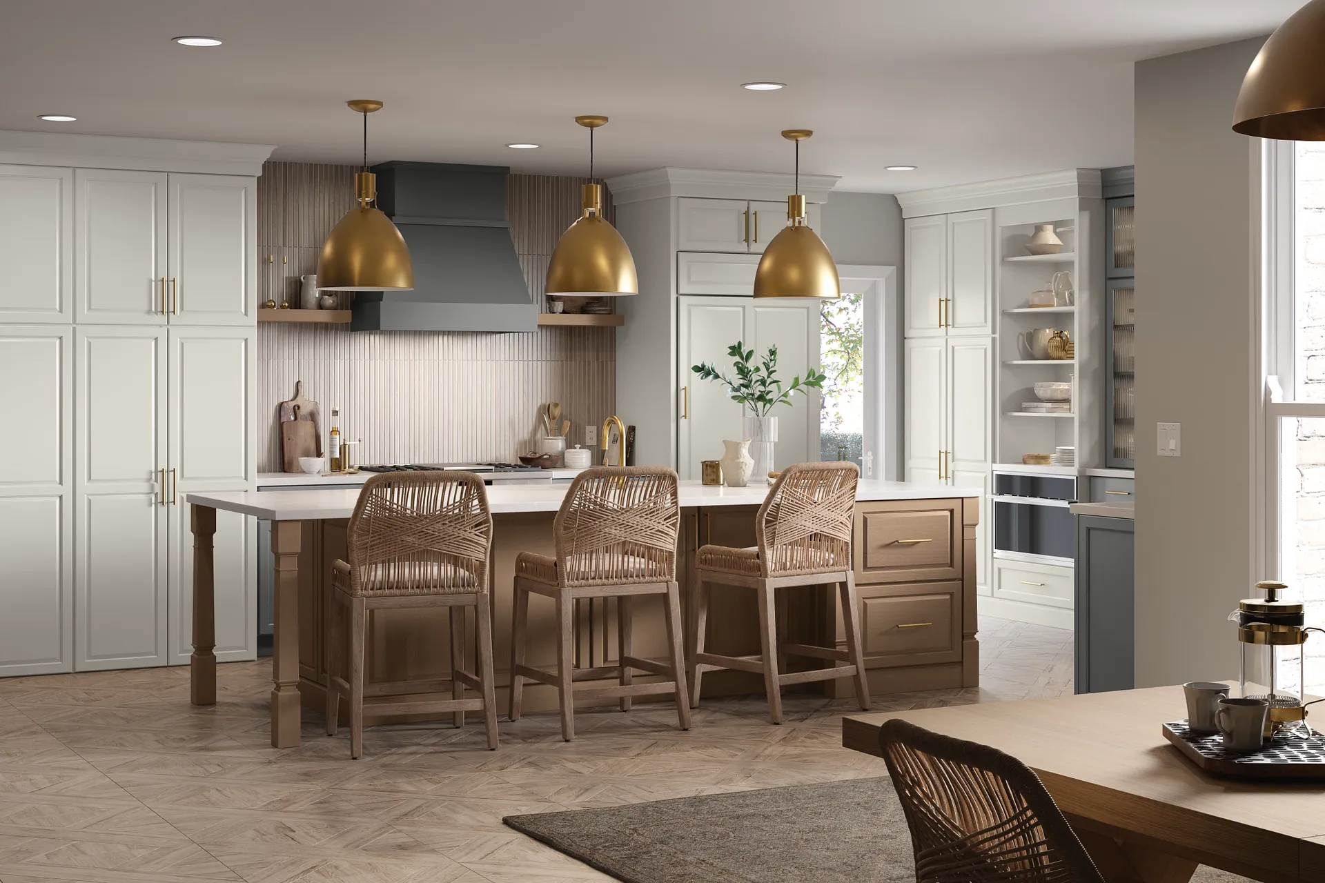 Bright, airy kitchen with cream cabinetry, brass hardware, and a large island