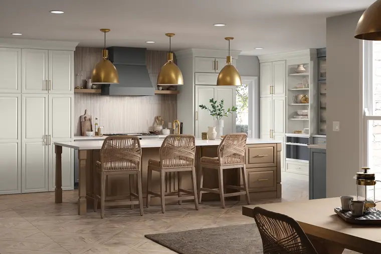 Bright, airy cream kitchen with brass hardware and a large island