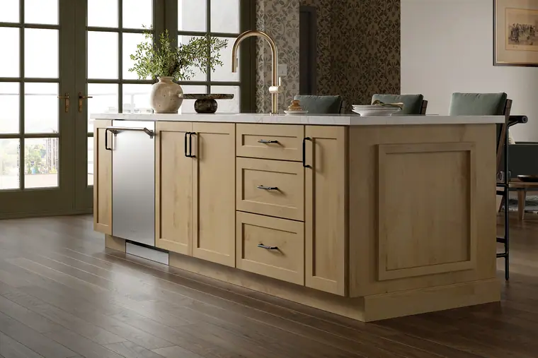 Driftwood island kitchen with green accents and big windows