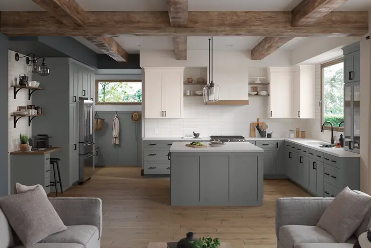 Gray-green kitchen with wood beams and a cozy seating area