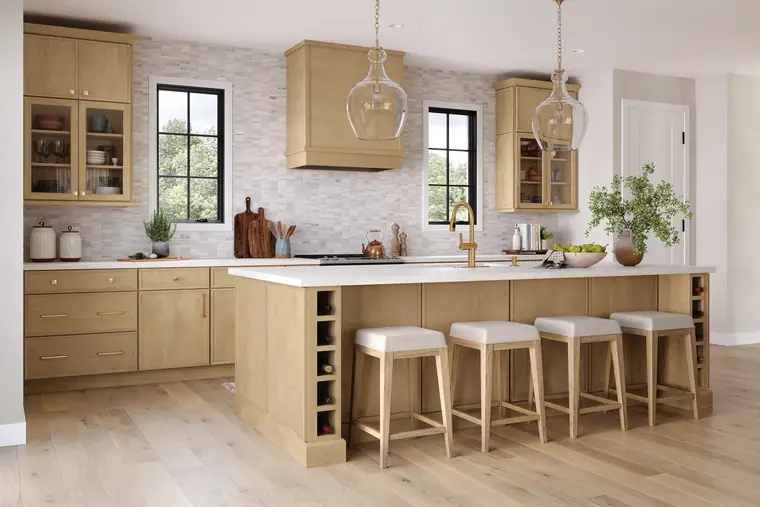 Light-oak Scandinavian kitchen with a large island and brass fixtures