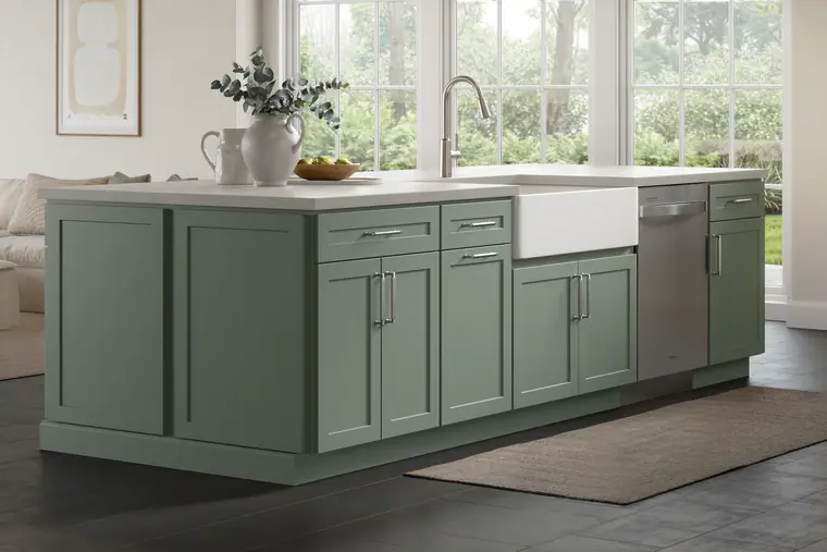 Sage-green kitchen island with a farmhouse sink and black windows