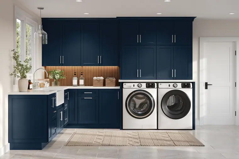 Navy laundry room with a folding counter and open shelf