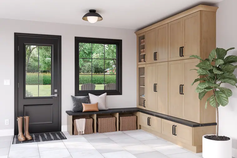 Maple mudroom with a bench and cubbies by a black door